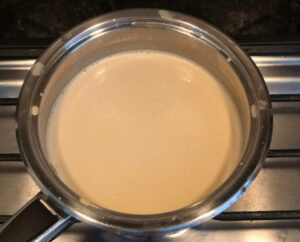 Plant based cheese sauce in a sauce pan