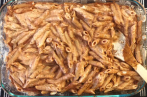 white sauce mixed with ziti