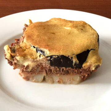 Moussaka piece on white plate