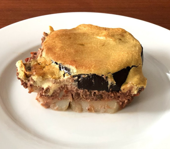 Moussaka piece on white plate