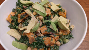Kale salad with all the ingredients mixed in