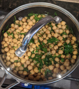 garbanzo beans and parsley in a pot