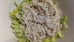 cooked noodles and lettuce