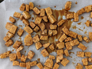 marinated tempeh on a sheet pan